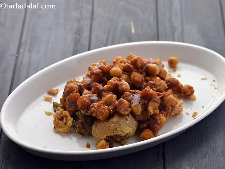 Step 29 – Put a portion of the prepared chole evenly over it.