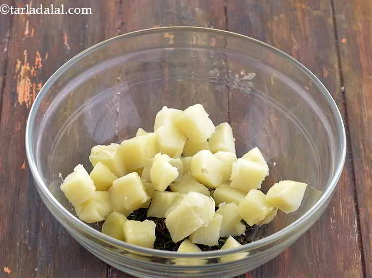 Step 27 – Now add the remaining ingredients. First add the boiled, peeled and cubed potatoes. You can …