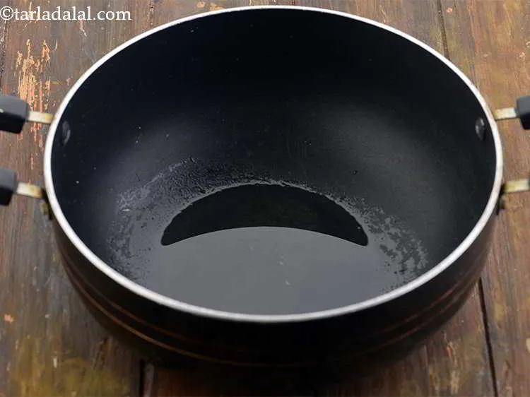 Step 7 – Heat the oil in a deep non-stick pan.
