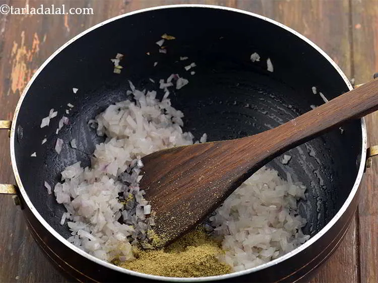 Step 10 – Now, add the masalas. First add the coriander-cumin seeds powder. This is really easily made …