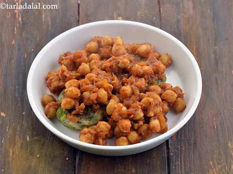 Step 43 – Divide the chole into 4 equal portions and spread 1 portion of the chole evenly …