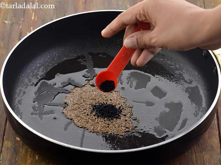 Step 23 – Also add the nigella seeds. These are also known as &ldquo;kalonji&rdquo; or onion seeds. They …