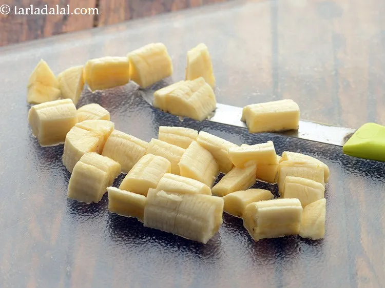 Step 7 – To this add 1/2 cup&nbsp;<a href="https://www.tarladalal.com/glossary-banana-cubes-18i">bananas cubes</a>.