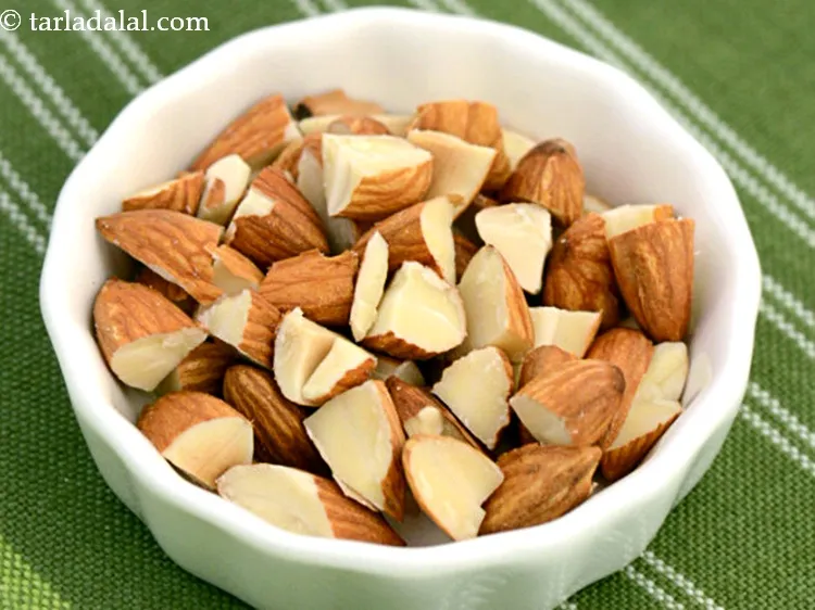 Step 10 – Sprinkle 2 tbsp&nbsp;<a href="https://www.tarladalal.com/glossary-chopped-almonds-865i">chopped almonds (badam)</a>&nbsp;evenly over it