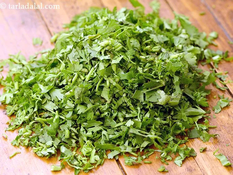 Step 20 – Add 1 tbsp&nbsp;finely&nbsp;<a href="https://www.tarladalal.com/glossary-chopped-coriander-783i">chopped coriander (dhania)</a>.