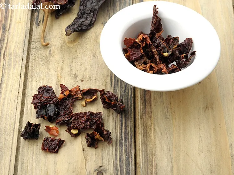 Step 9 – Add 1 tbsp&nbsp;<a href="https://www.tarladalal.com/glossary-chopped-dry-kashmiri-red-chillies-2549i">chopped dry kashmiri red chillies</a>.