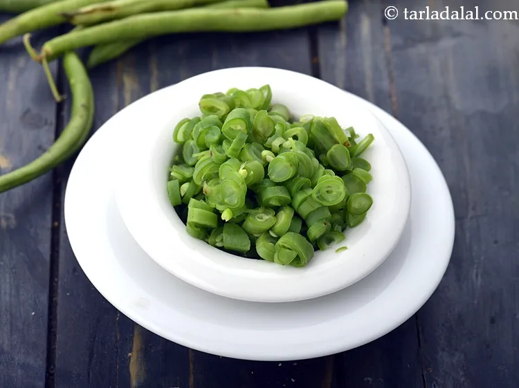 Step 14 – Add 1/4 cup&nbsp;<a href="https://www.tarladalal.com/glossary-chopped-french-beans-797i">chopped french beans</a>.