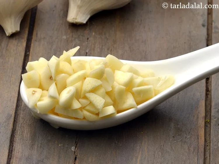 Step 9 – Add 1 tsp&nbsp;finely&nbsp;<a href="https://www.tarladalal.com/glossary-chopped-garlic-790i">chopped garlic (lehsun)</a>.