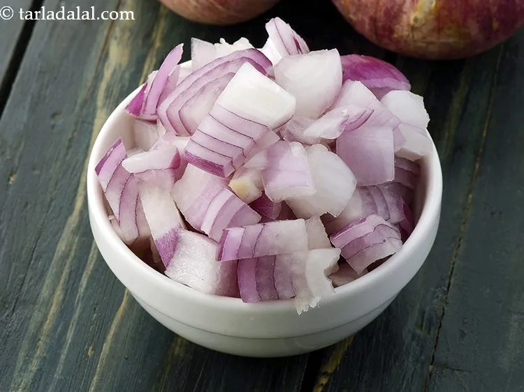 Step 27 – Add 1/2 cup&nbsp;finely&nbsp;<a href="https://www.tarladalal.com/glossary-chopped-onions-722i">chopped onions</a>.