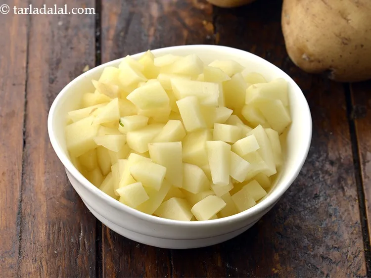 Step 25 – Ensure to chop the potatoes finely so that it cooks faster.&nbsp;