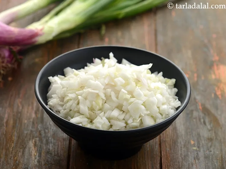 Step 7 – Add 1/4 cup&nbsp;<a href="https://www.tarladalal.com/glossary-chopped-spring-onion-whites-815i">chopped spring onions whites</a>.