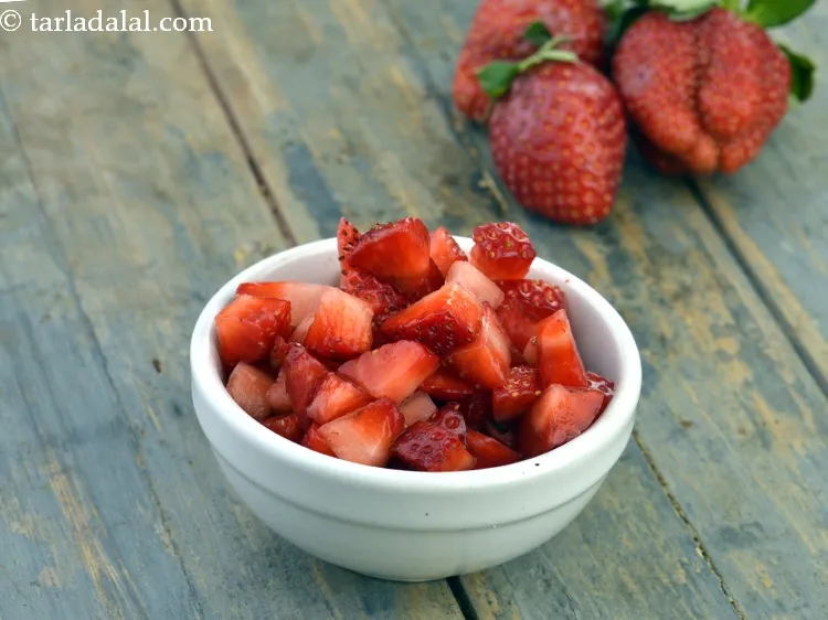 Step 12 – Sprinkle 1/4 cup&nbsp;<a href="https://www.tarladalal.com/glossary-chopped-strawberries-808i">chopped strawberries</a>.