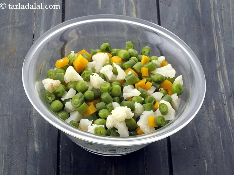 Step 44 – Add 1/2 cup&nbsp;<a href="https://www.tarladalal.com/glossary-chopped-and-boiled-mixed-vegetables-1884i">chopped and boiled mixed vegetables</a>&nbsp;(french beans , carrots and green peas).&nbsp;<a href="https://www.tarladalal.com/recipes-using-mixed-vegetables-723">Mixed …