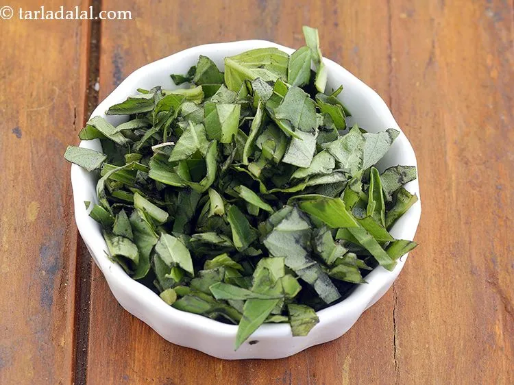 Step 8 – Add 1 tbsp&nbsp;<a href="https://www.tarladalal.com/glossary-chopped-basil-804i">chopped basil leaves</a>.
