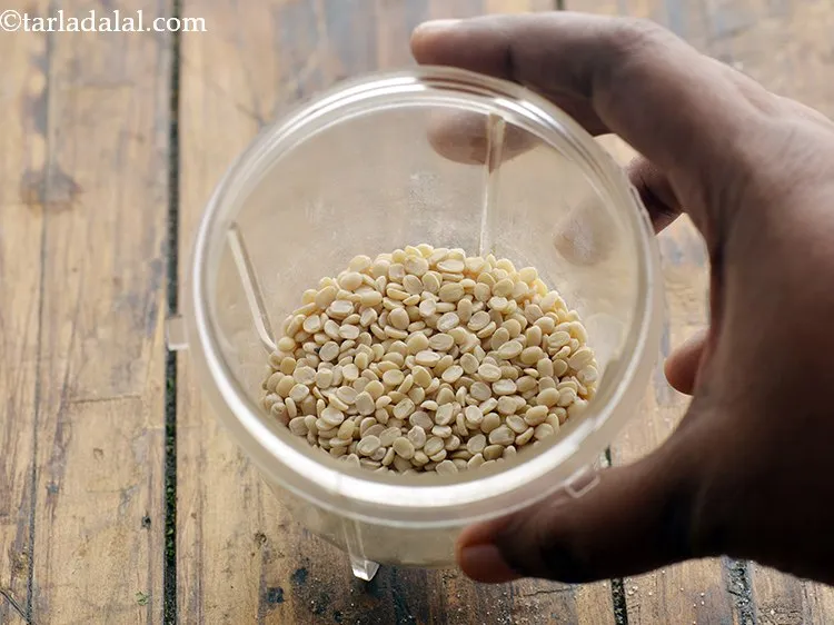 Step 8 – For the <strong>Chorafali</strong>, take approx. 3 tbsp of urad dal&nbsp; in a mixer jar.&nbsp;