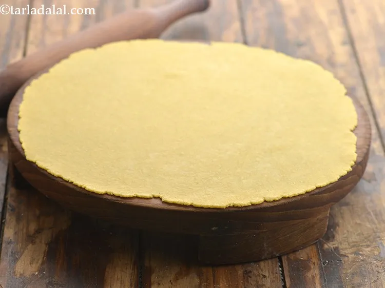 Step 22 – Roll into a 250 mm. (10&rdquo;) circle without using flour. Rolling it uniformly is very …