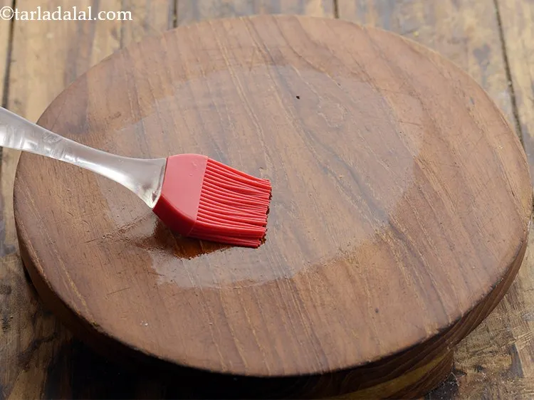 Step 19 – Grease a rolling board with a little oil &ndash; approx. &frac12; tsp.&nbsp;