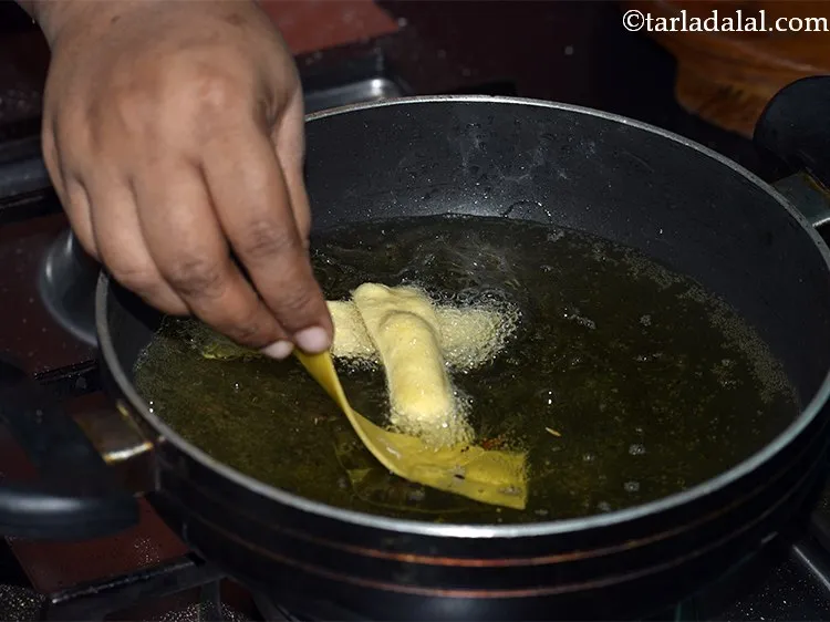 Step 24 – Heat the oil for deep-frying and add a few <strong>Chorafali </strong>strips in it at a …
