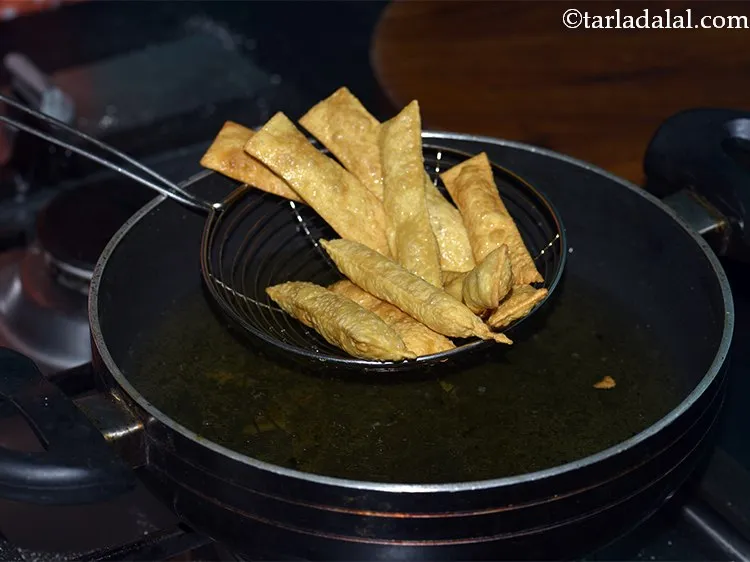 Step 25 – Deep fry on a slow flame till this <strong>Indian Diwali Snack</strong> turns light brown in …