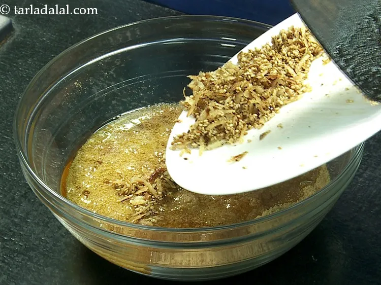 स्टेप 28 – नारियल-तिल का मिश्रण डालें। आप मिश्रण में कुचले हुए या …