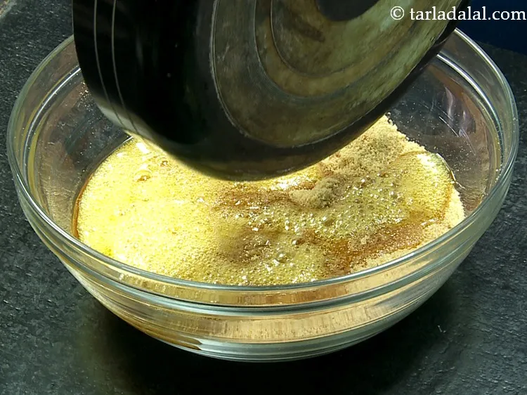 स्टेप 27 – आंच से उतार लें और तैयार चूरमा मिश्रण में डालें।