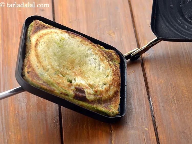 Step 17 – Place the sandwich in a greased sandwich toaster and cook on a medium flame, till …