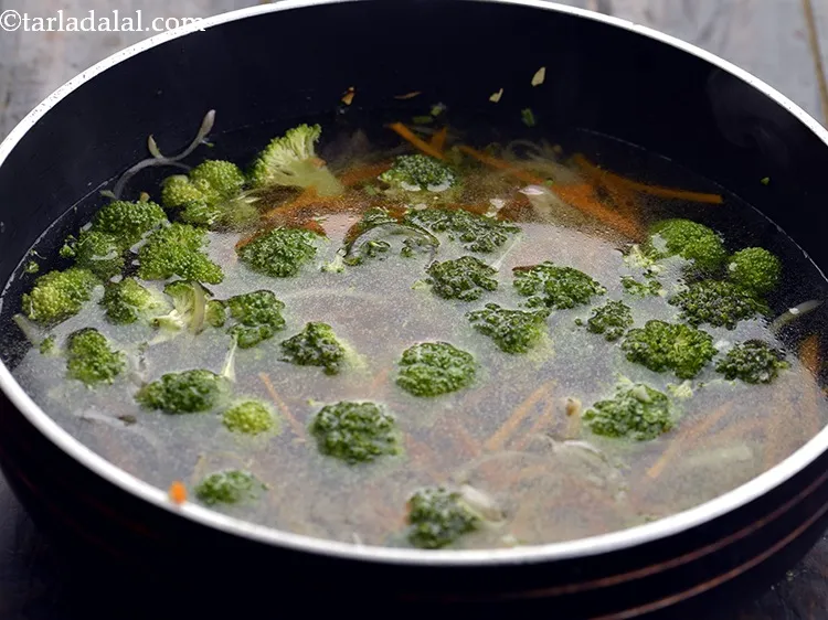 Step 10 – Add 4 cups of hot water. The addition of hot water helps in quick cooking …