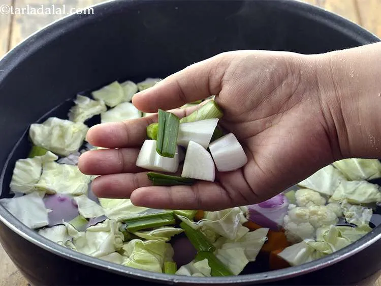 Step 8 – Finally add the spring onions to the <strong>Clear Vegetable Stock</strong>.
