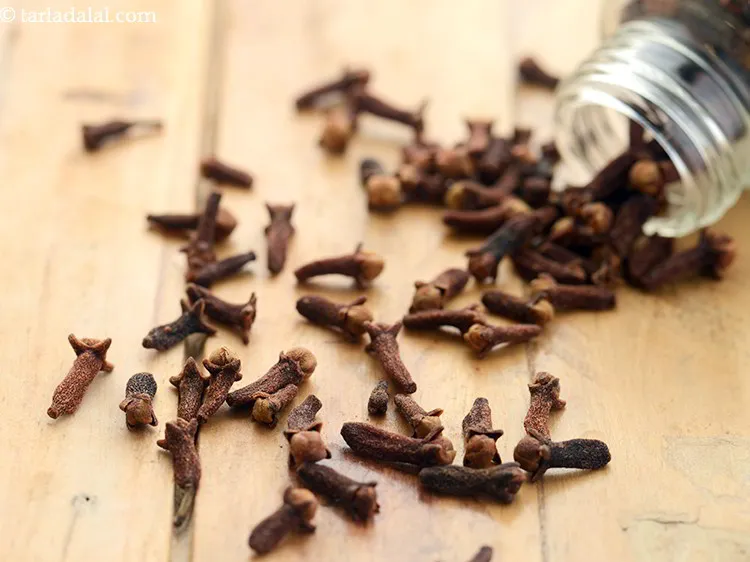 Step 33 – Add 2&nbsp;<a href="https://www.tarladalal.com/glossary-cloves-322i">cloves (laung / lavang)</a>.