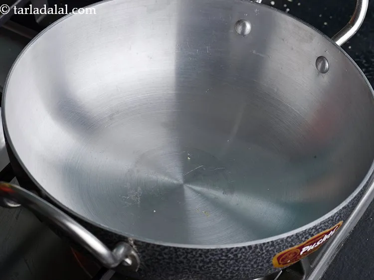 Step 3 – Then to make <strong>kopra chikki Indian recipe</strong>, heat an aluminium kadhai on a high flame. …