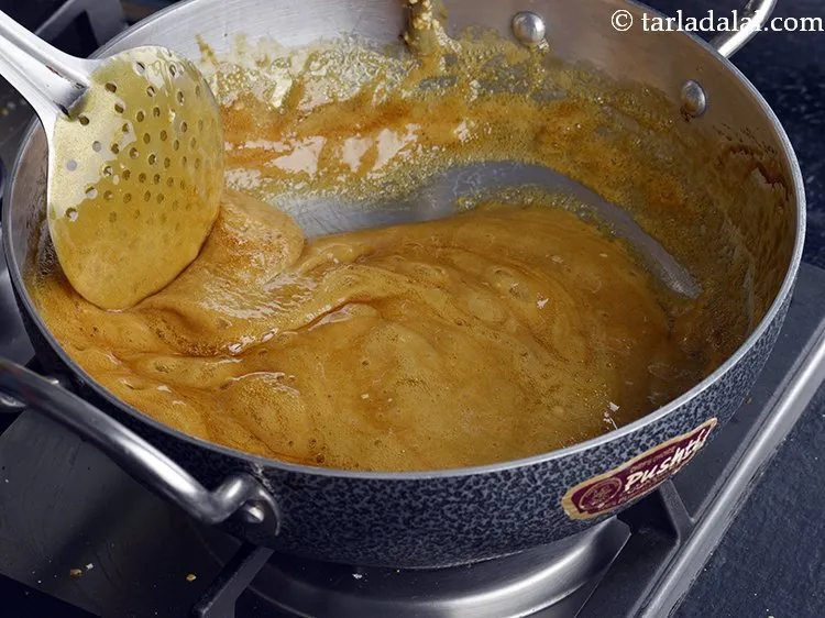 Step 6 – Lower the flame to slow and keep stirring continuously for 2 minutes, till the jaggery …
