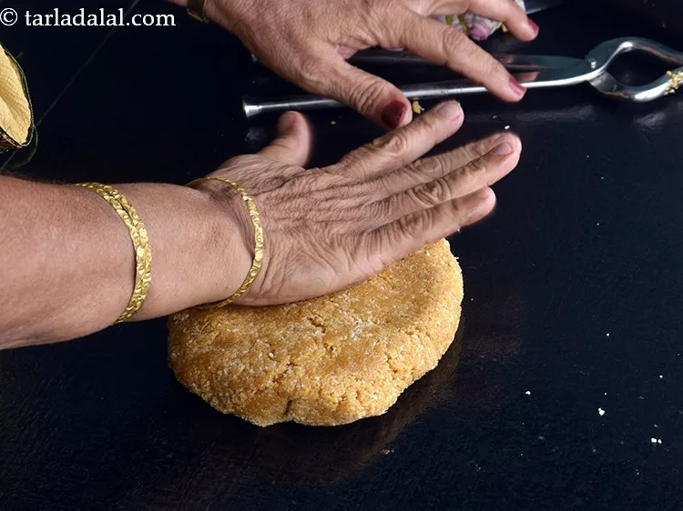 Step 11 – Pat the mixture, with greased hands.&nbsp;