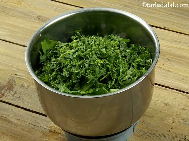 Step 3 – Add the coriander. Rinse it in water and chop it before adding to the mixer …