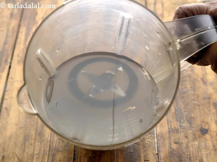 Step 19 – Add the&nbsp;<strong>coconut drink</strong>&nbsp;into a mixer jar.