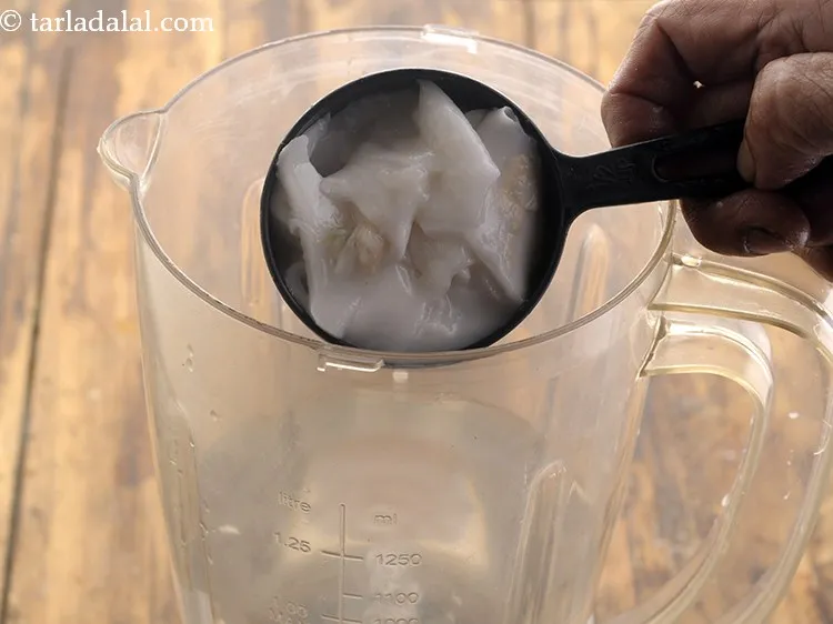 Step 20 – Add the coconut flesh to it.