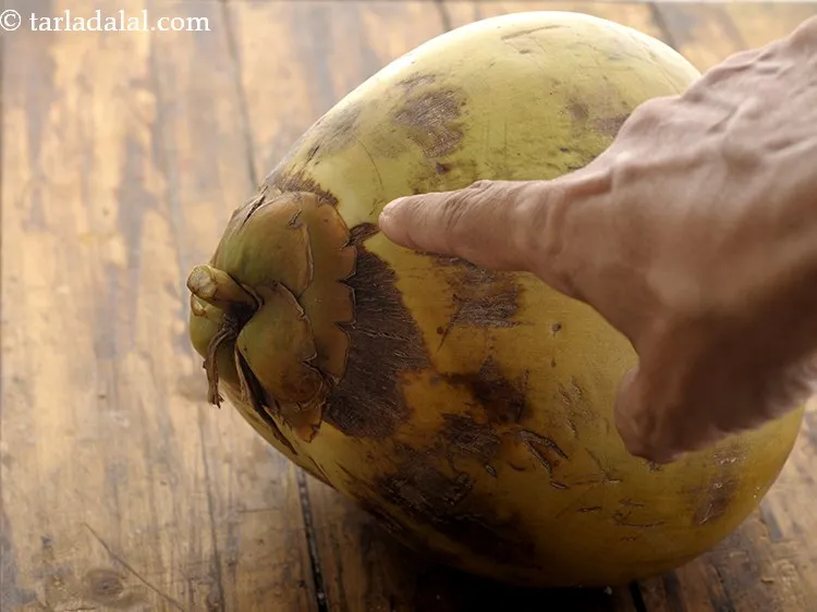 Step 12 – Now for&nbsp;<strong>healthy coconut drink for runners&nbsp;</strong><strong>&nbsp;</strong>the coconut is to be sliced from the top.