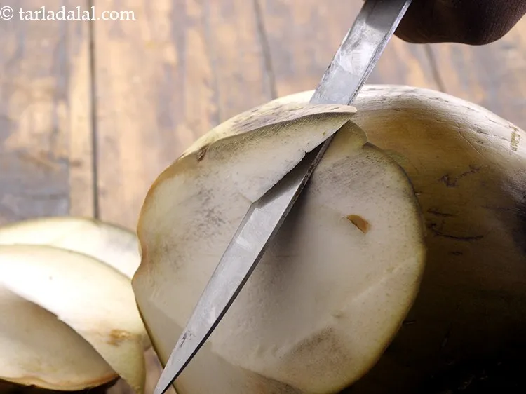 Step 13 – Cut the top portion of coconut at an angle as shown.&nbsp;Continue the same procedure till …