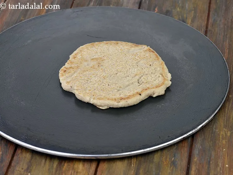 Step 16 – Pour a ladleful of the batter and spread it in a circular motion to make …