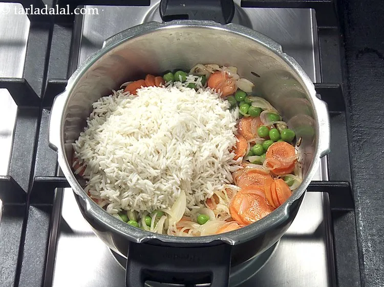 Step 31 – Add the soaked and drained Basmati rice. See above how to soak Basmati rice.
