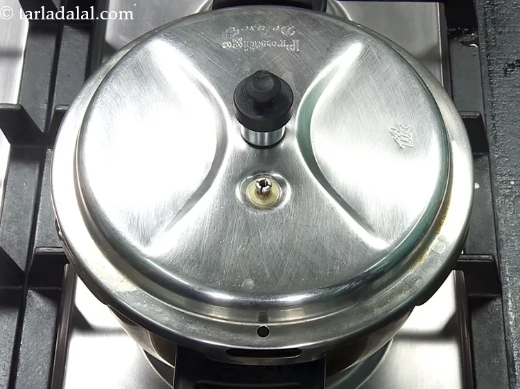 Step 37 – Close the lid of the pressure cooker and pressure cook for 2 whistles. Allow the …