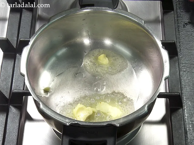 Step 22 – Also add 1 tsp&nbsp;<a href="https://www.tarladalal.com/glossary-butter-makhan-233i">butter</a> to it. Butter adds a smooth and glossy look to …