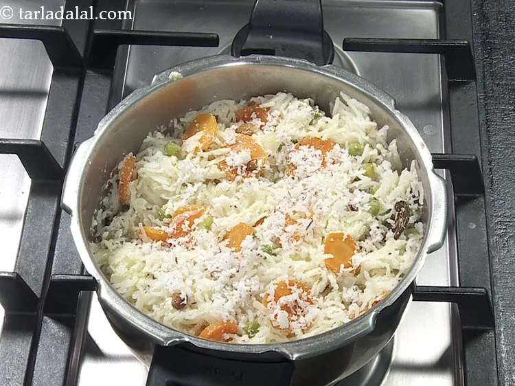 Step 40 – Garnish with 2 tbsp&nbsp;<a href="https://www.tarladalal.com/glossary-grated-coconut-852i">grated coconut</a>.