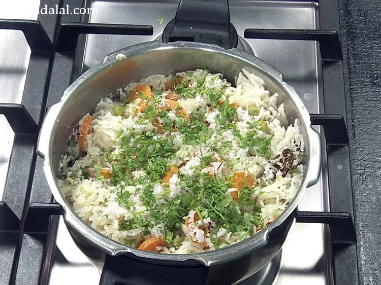 Step 41 – Also garnish with 2 tbsp&nbsp;<a href="https://www.tarladalal.com/glossary-chopped-coriander-783i">chopped coriander (dhania)</a>.