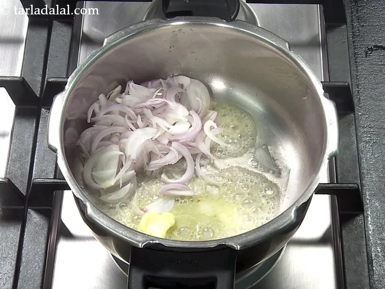 Step 23 – Add 1/2 cup&nbsp;<a href="https://www.tarladalal.com/glossary-sliced-onions-745i">sliced onions</a>.