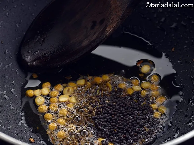 Step 21 – Add the mustard seeds.