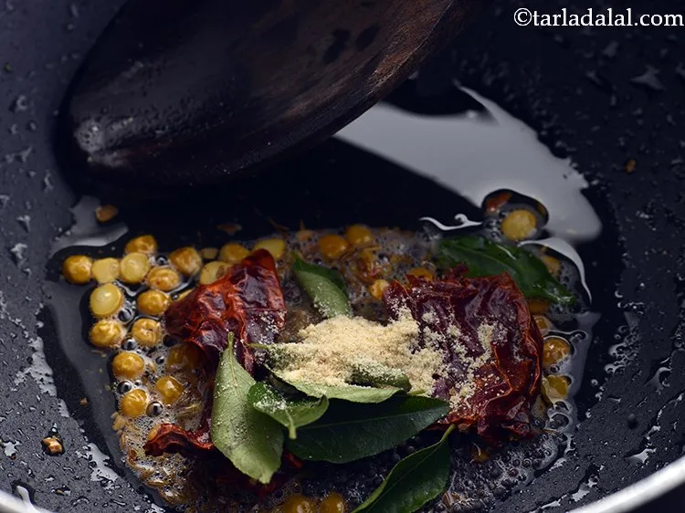 Step 23 – Add the curry leaves and asafoetida.
