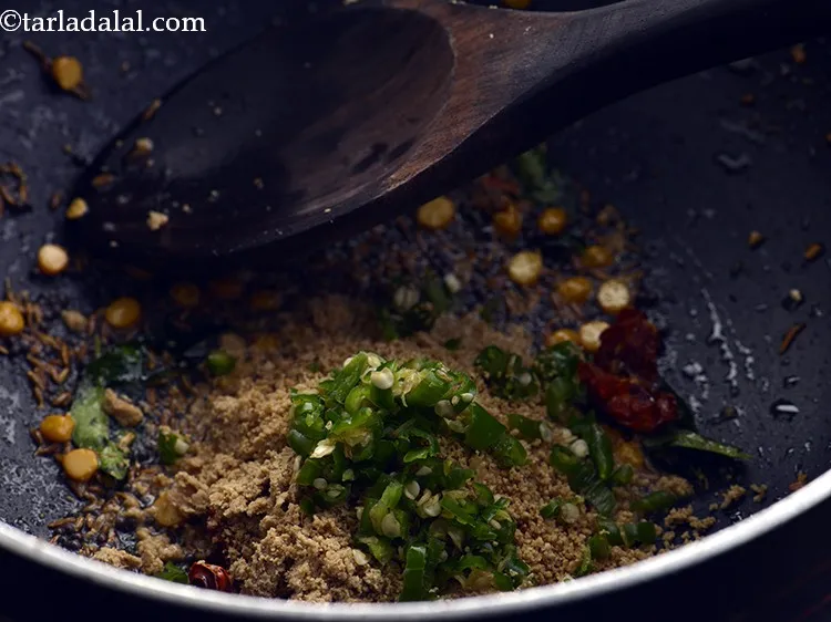Step 26 – Add the green chillies. If making for kids, add slit chillies and then remove them …