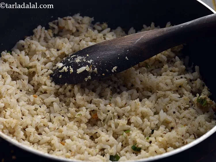 Step 29 – Mix well and cook the <strong>Coconut Rice</strong> on a medium flame for 2 to 3 …