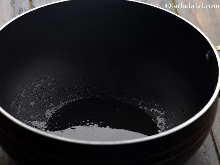 Step 15 – Heat the ghee in the deep-non kadhai.