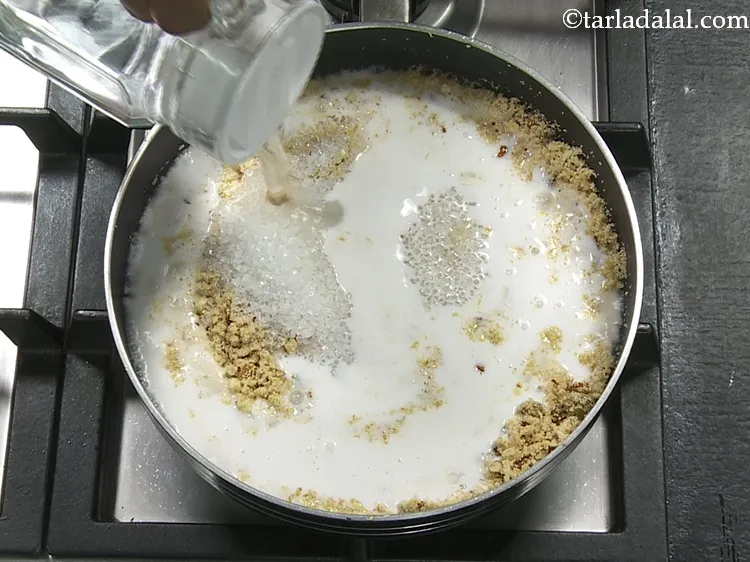 Step 10 – <p>Add coconut milk and 1 cup of water. These liquid help in cooking the semolina. …